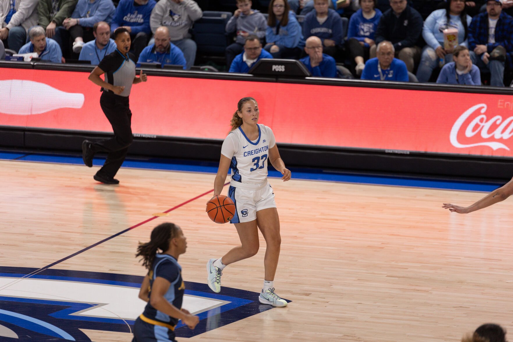 Senior Brooke Littrell dribbles the ball over half court in the Bluejays' contest with the Golden Eagles.