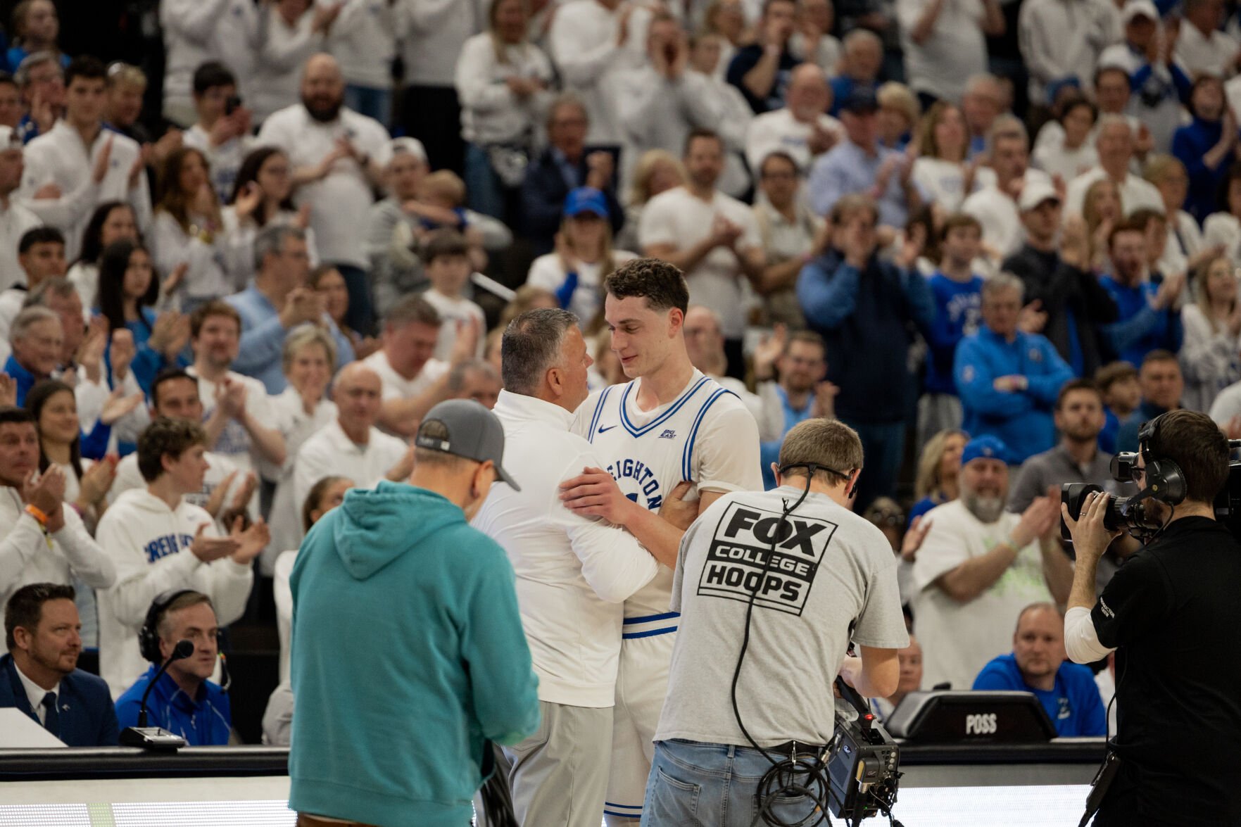 Senior Ryan Kalkbrenner and Head Coach Greg McDermott embrace on Senior Day after Kalkbrenner checks out of his final game at CHI Health Center in his college career.
