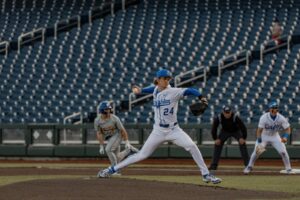 Junior pitcher Ian Koosman, leans forward, preparing to finish out his pitch in Crieghton's battle with South Dakota.