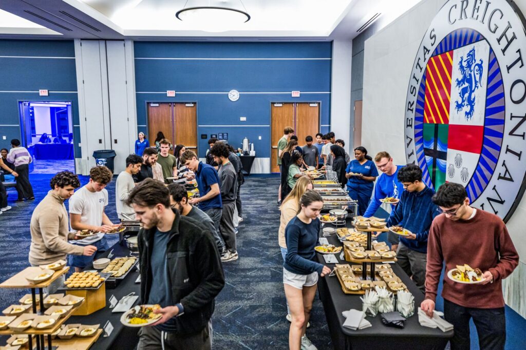 Students line up to grab food provided by the Muslim Student Association (MSA), Creighton Intercultural Center (CIC) and Campus Ministry at Iftar.
