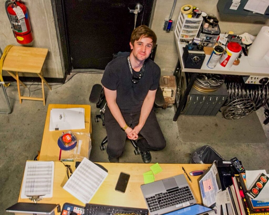 Kevin Rooney works as the head projectionist for the Ruth Sokolf Theater.