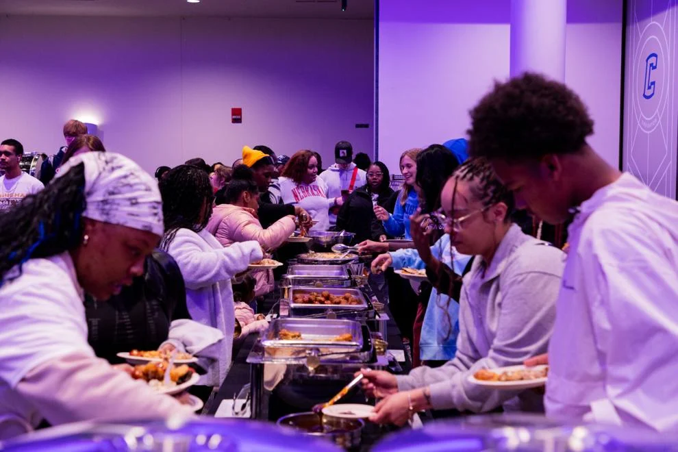 Students gather in the Skutt Ballroom to enjoy refreshments during the VIP Center's event.