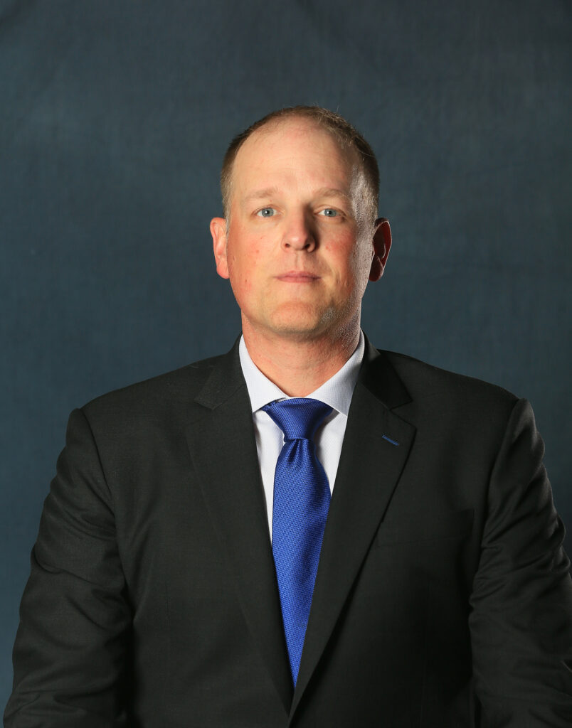 A headshot of Alan Huss
