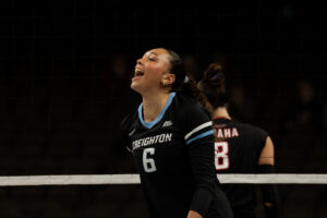 Right-side hitter Jaya Johnson celebrates after a kill.
