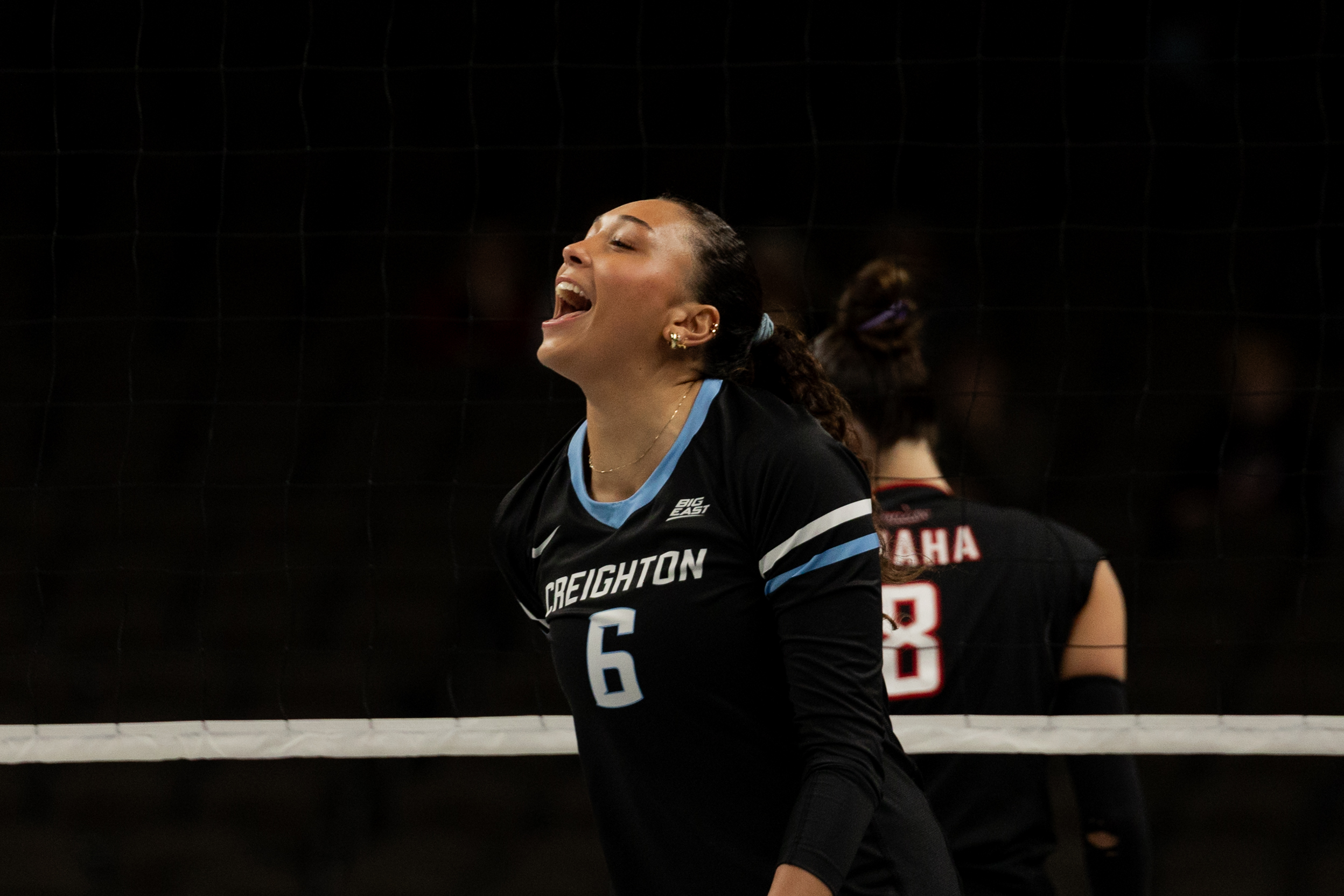 Right-side hitter Jaya Johnson celebrates after a kill.