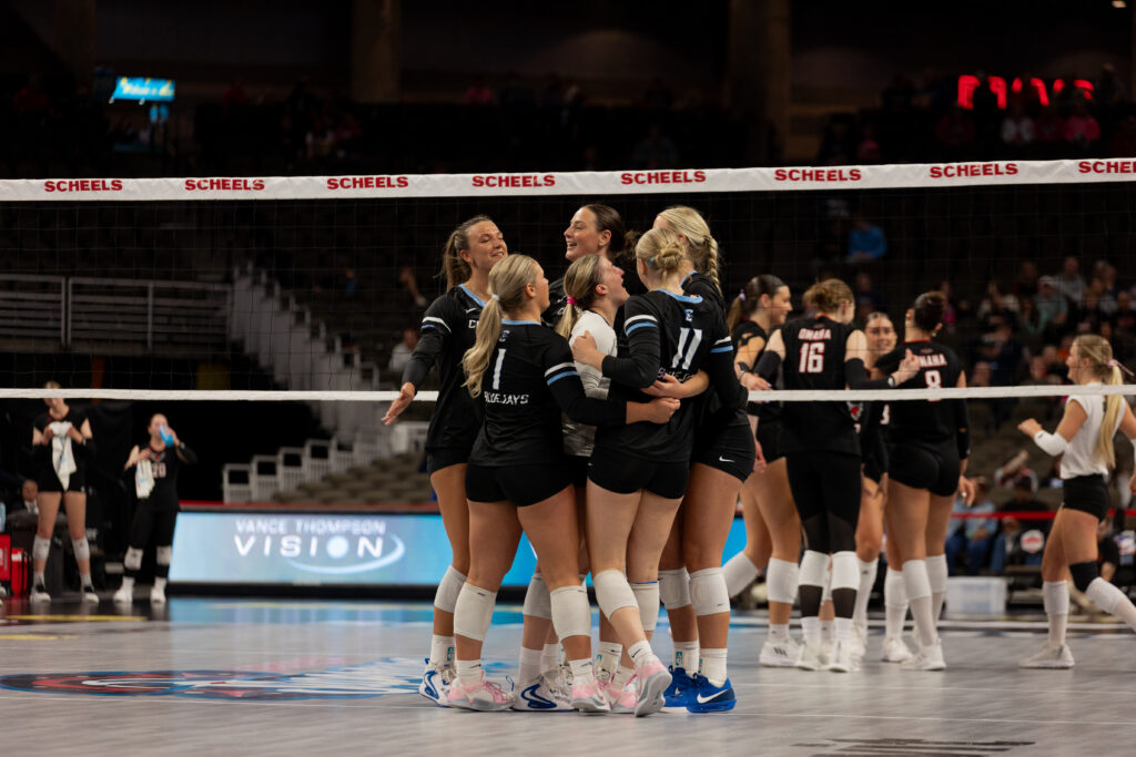 The team celebrates after a block from freshman Ashlyn Paymal.
