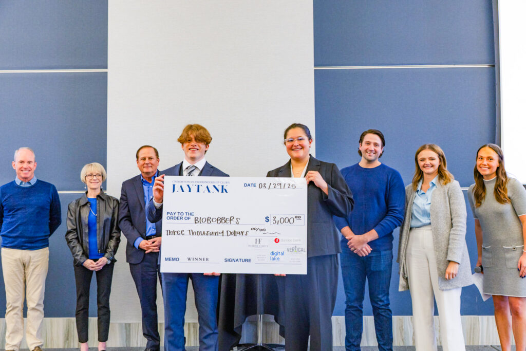 Students pose with the winning check.