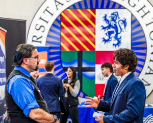 Student talks to a potential employer
