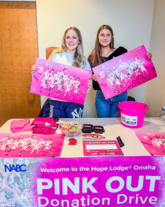 The club volunteered for the paper product drive at Creighton's pink-out basketball game.