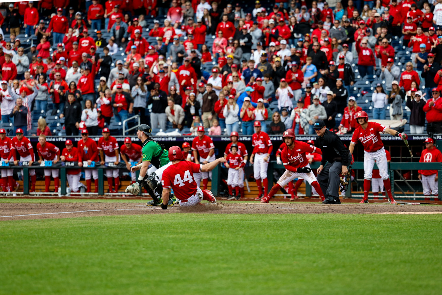 Nebraska's Gabe Swanson slides into home plate in the Huskers' 7-3 win over Oregon.
