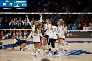 Volleyball celebrates after a monster block from Kiara Reinhardt.