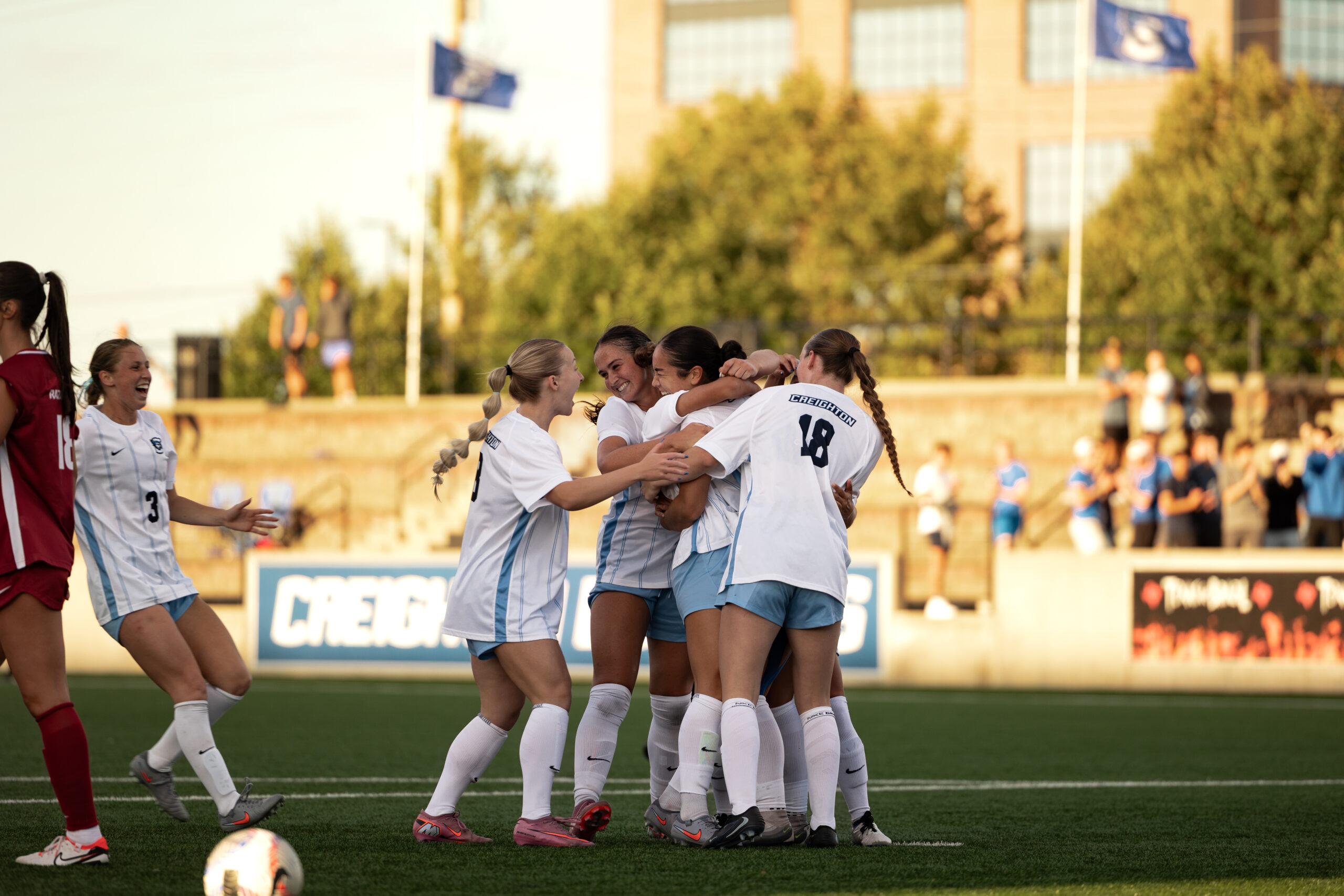 Freshman Jalen Chaney celebrates with her teammates after heading the ball in to tie the match at 2-2.
