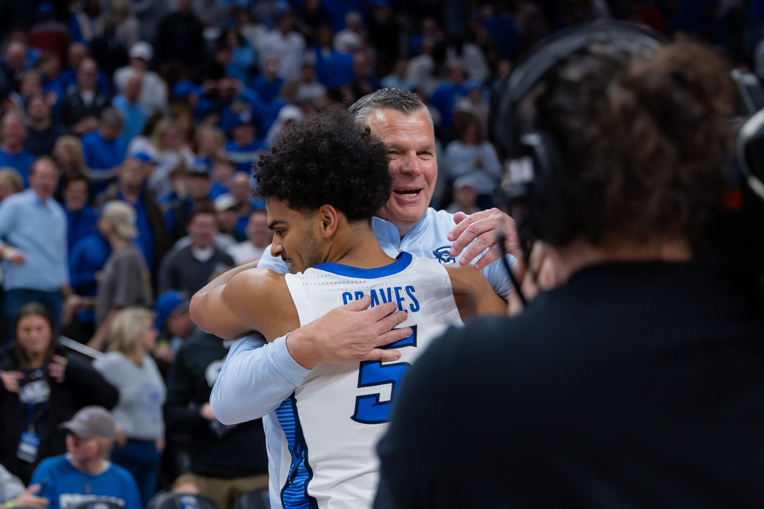 Head coach Greg McDermott embraces senior Nik Graves after his go-ahead 3-pointer.